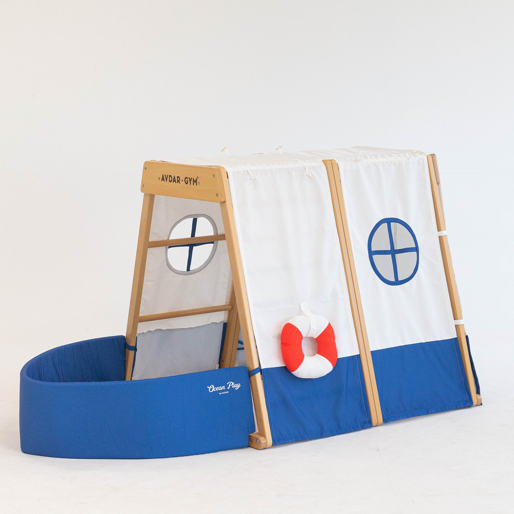 Children play tent in marine style. Play boat
