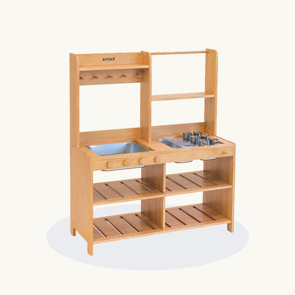 AVDAR Mud Kitchen in natural wood with two metal sinks, stovetop rings, knobs, hooks and open shelves