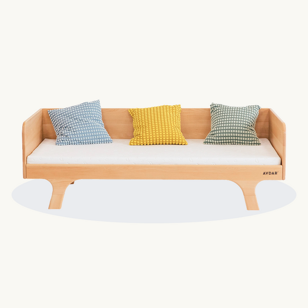 AVDAR Hug Hug Bed 90 x 200 in natural wood with white mattress and blue, yellow and green cushions