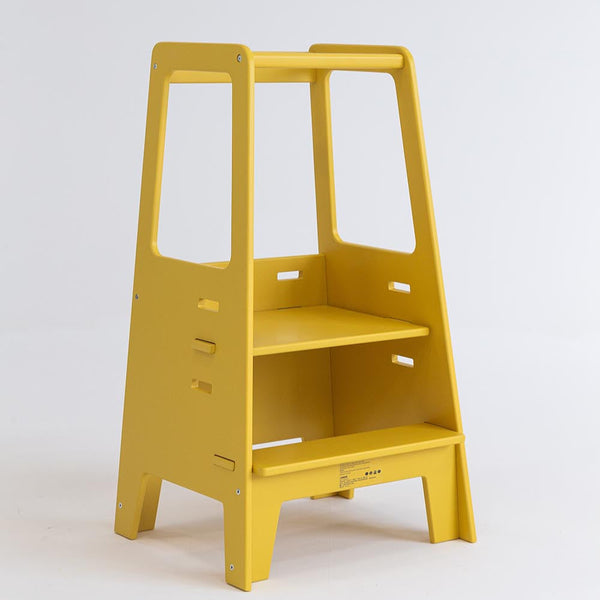 Yellow Toddler Tower with two steps, adjustable platform and safety rails on a white background