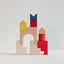 Colorful wooden building blocks on a light gray background