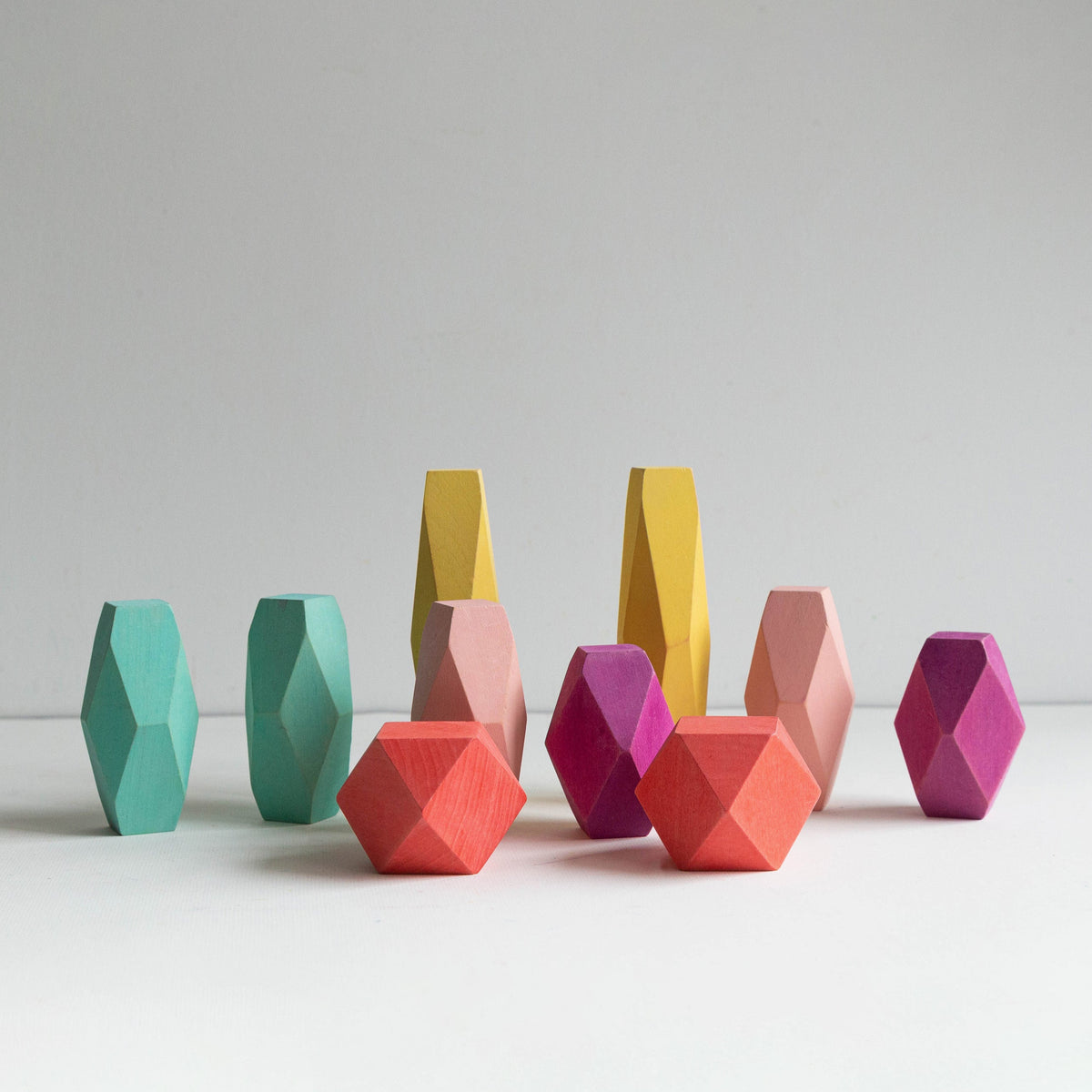 Balance Block set with colorful faceted wooden balancing pieces on a white background