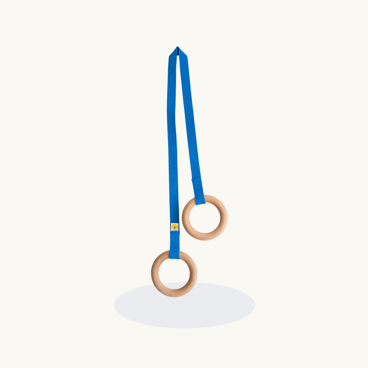 Wooden gymnastic rings with a blue strap on a white background