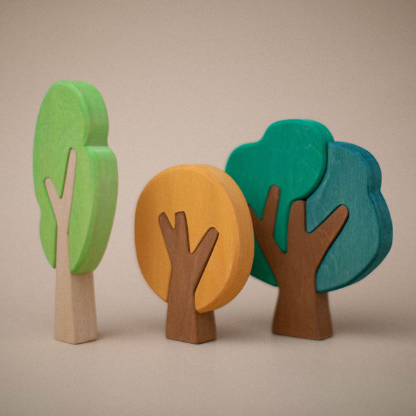Flat Forest Set with three wooden trees in light green, yellow, teal and blue