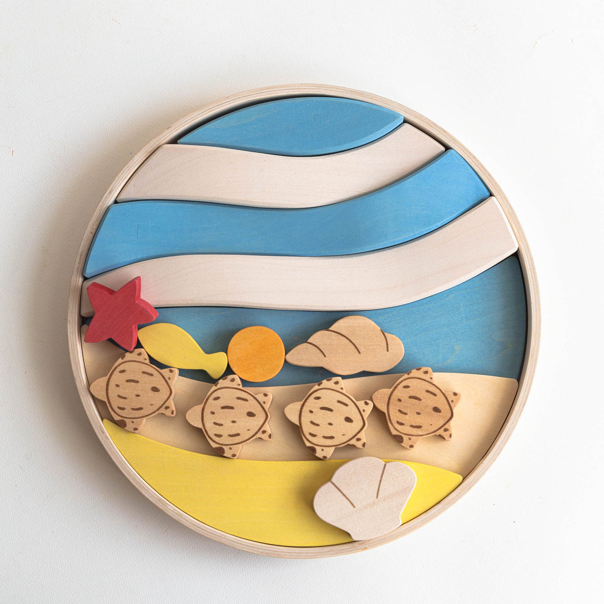 A wooden puzzle toy featuring colorful layers and turtle figures on a round carrying tray.