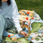 Kingdom Valley play cloth used outdoors with wooden blocks and toy vehicles