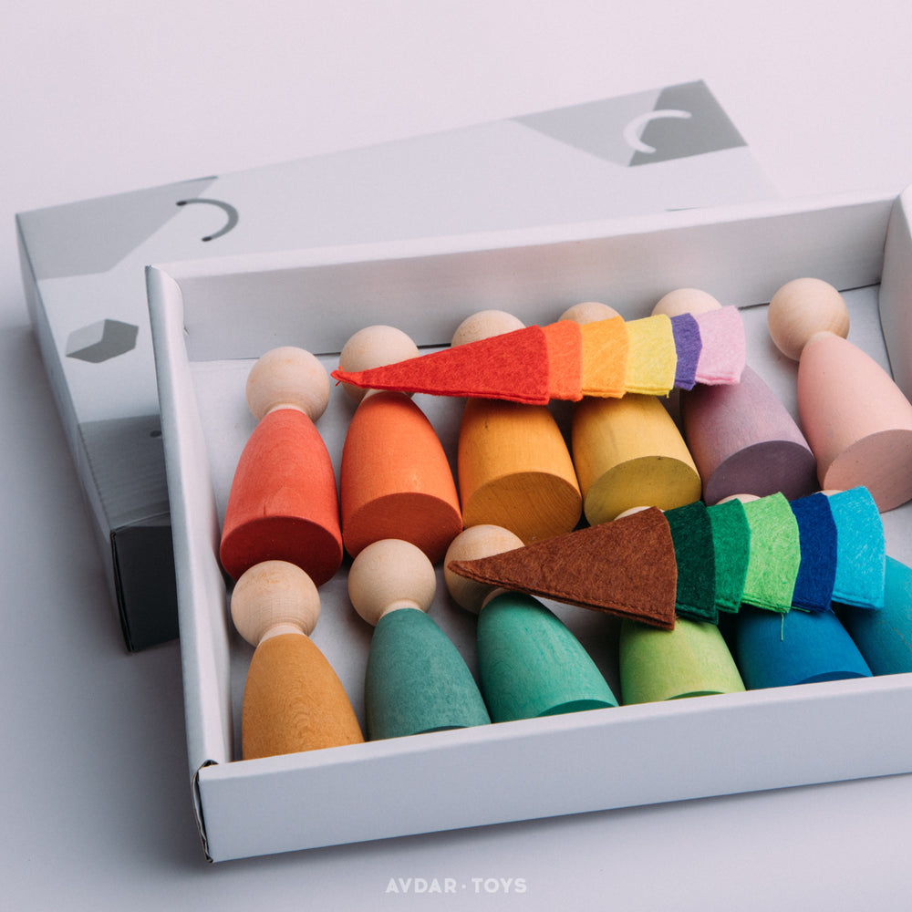 A set of colorful wooden peg dolls and different colored hats.